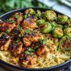 Maple Garlic Chicken Bites with Spicy Cajun Alfredo & Crispy Brussels Twists