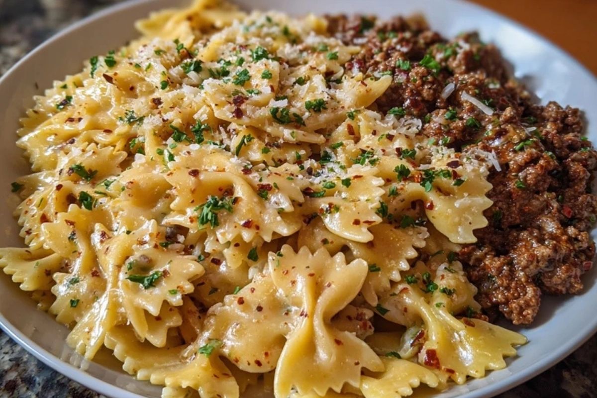 Cheesy Bowtie Pasta with Savory Cajun Ground Beef in Garlic Cream