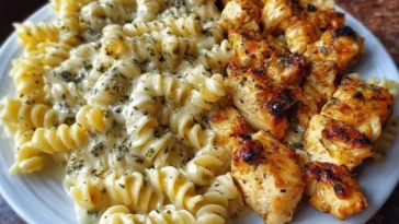 Cheesy Alfredo Twisted Pasta with Golden Garlic Butter Chicken in Creamy Sauce 1