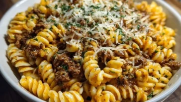 Cheesy Garlic Twisted Pasta with Cajun Ground Beef and Alfredo Velveeta 1